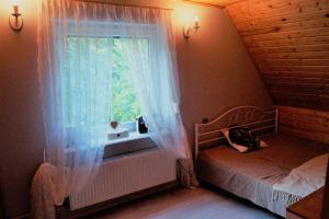Zdjęcie z galerii obiektu Uroczy domek do wynajęcia w Bogaczewie nad jeziorem Narie w Morągu