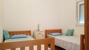 Postel nebo postele na pokoji v ubytování Apartment Dario