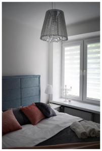 Posteľ alebo postele v izbe v ubytovaní Color24 Apartament
