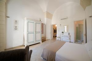 A bed or beds in a room at Nuvole Barocche