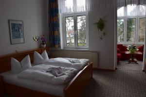 Postel nebo postele na pokoji v ubytování Hotel Nordlicht