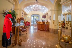 a person wearing a santa suit standing in a lobby at Schlosshotel Römischer Kaiser in Vienna