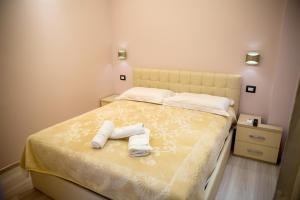 Postel nebo postele na pokoji v ubytování San Marino Hotel