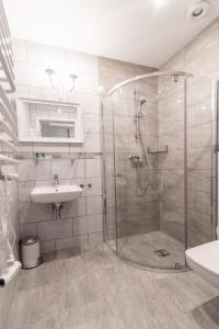 a bathroom with a shower and a sink at Premium - Bed & Breakfast in Malbork