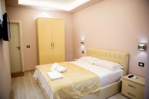 Postel nebo postele na pokoji v ubytování San Marino Hotel