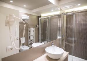 Koupelna v ubytování Airone City Hotel