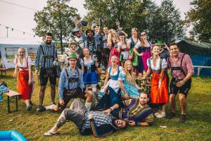 a group of people posing for a picture at Festanation Oktoberfest Camp #2 in Munich