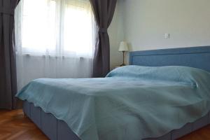 Postel nebo postele na pokoji v ubytování Apartment Anna Split With Parking