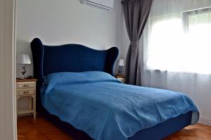 Postel nebo postele na pokoji v ubytování Apartment Anna Split With Parking