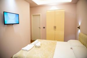 Postel nebo postele na pokoji v ubytování San Marino Hotel