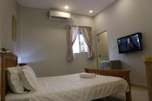 Postel nebo postele na pokoji v ubytování Long Hostel