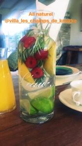 a glass vase filled with fruit on a table at villa les champs de knokke in Knokke-Heist
