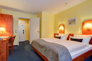 Ένα ή περισσότερα κρεβάτια σε δωμάτιο στο Hotel Elbinsel free parking