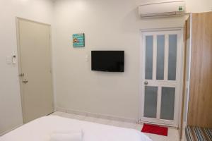 TV a/nebo společenská místnost v ubytování Long Hostel
