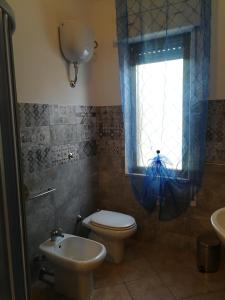 Ένα μπάνιο στο Mandriola Putzuidu Capo Mannu