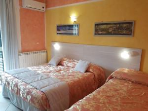 A bed or beds in a room at Il Laghetto