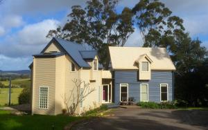 a house with a blue and white house at Haven Villa in Berry