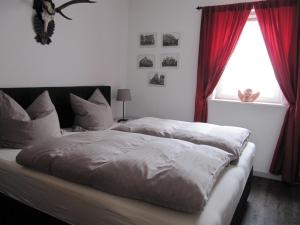 Ein Bett oder Betten in einem Zimmer der Unterkunft Piepmäker Stübchen