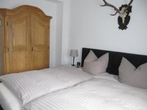 Ein Bett oder Betten in einem Zimmer der Unterkunft Piepmäker Stübchen