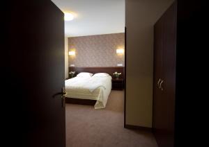 מיטה או מיטות בחדר ב-Hotel Centrum