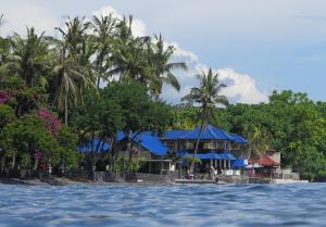 a resort from the water on a tropical island at Matahari Tulamben Resort, Dive & SPA in Tulamben