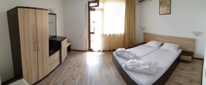 A bed or beds in a room at Villa Diana Self check-in