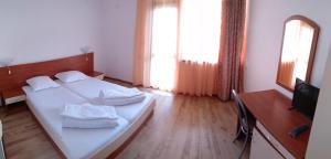 A bed or beds in a room at Villa Diana Self check-in