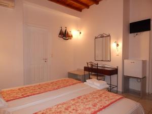 Posteľ alebo postele v izbe v ubytovaní Nisiotiko house in Tinos near the beach
