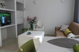 a living room with a couch and a table at Myron Suite Old Town in Rethymno