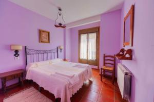 Postel nebo postele na pokoji v ubytování Casa Rural la Casa Grande + 4 fotografie