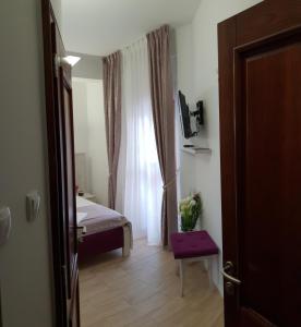Voodi või voodid majutusasutuse Apis Hotel toas
