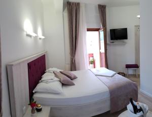 Voodi või voodid majutusasutuse Apis Hotel toas