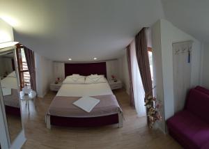 Voodi või voodid majutusasutuse Apis Hotel toas