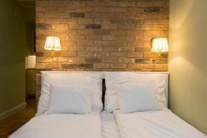 Posteľ alebo postele v izbe v ubytovaní Roland Apartments