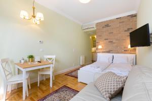 Posteľ alebo postele v izbe v ubytovaní Roland Apartments