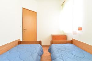 Postel nebo postele na pokoji v ubytování Apartments Denis 344