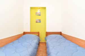 Postel nebo postele na pokoji v ubytování Apartments Denis 344