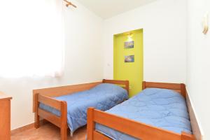 Postel nebo postele na pokoji v ubytování Apartments Denis 344