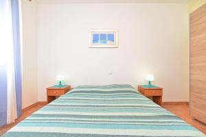 Postel nebo postele na pokoji v ubytování Apartments Denis 344