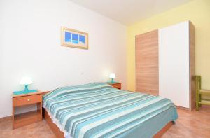 Postel nebo postele na pokoji v ubytování Apartments Denis 344