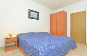 Postel nebo postele na pokoji v ubytování Apartments Denis 344