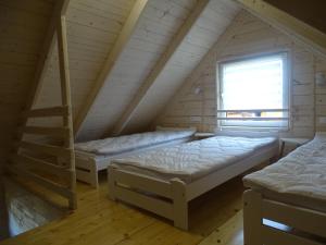 Una cama o camas en una habitación de MORELOWE domki nad morzem