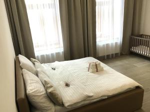 Postel nebo postele na pokoji v ubytování EURO APARTMENTS LIDICKÁ 39 BRNO