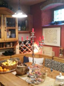 a kitchen with a table with a christmas tree on it at B&B Villa Ca'Praja in Daone