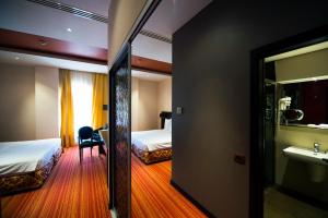 Postel nebo postele na pokoji v ubytování Nane Hotel