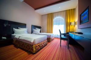 Postel nebo postele na pokoji v ubytování Nane Hotel