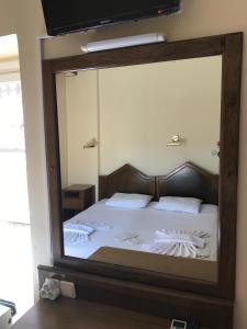 Ein Bett oder Betten in einem Zimmer der Unterkunft Antik Ridvan Hotel