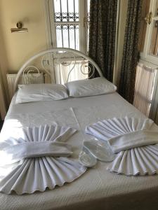Ein Bett oder Betten in einem Zimmer der Unterkunft Antik Ridvan Hotel