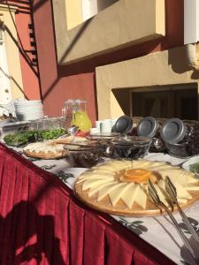 a table with plates of food on top at Antik Ridvan Hotel in Çeşme