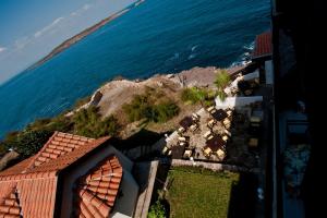 an aerial view of a house and the ocean at Guest House Doctor's House in Sozopol